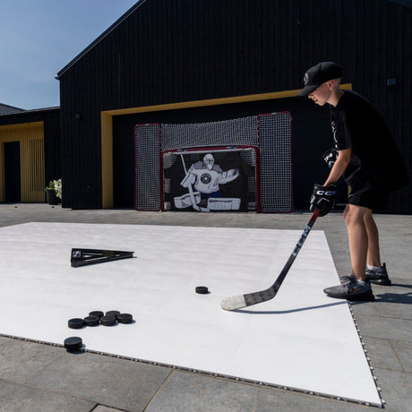 Hockey player training on Better Hockey flooring tiles in a garage