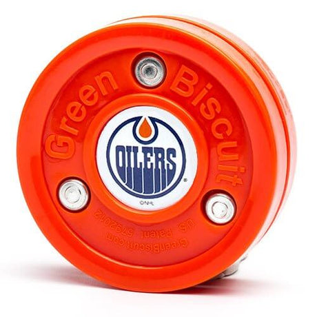 Green Biscuit NHL teknikpuck i orange, designad för off-ice träning av klubbteknik och passningar.